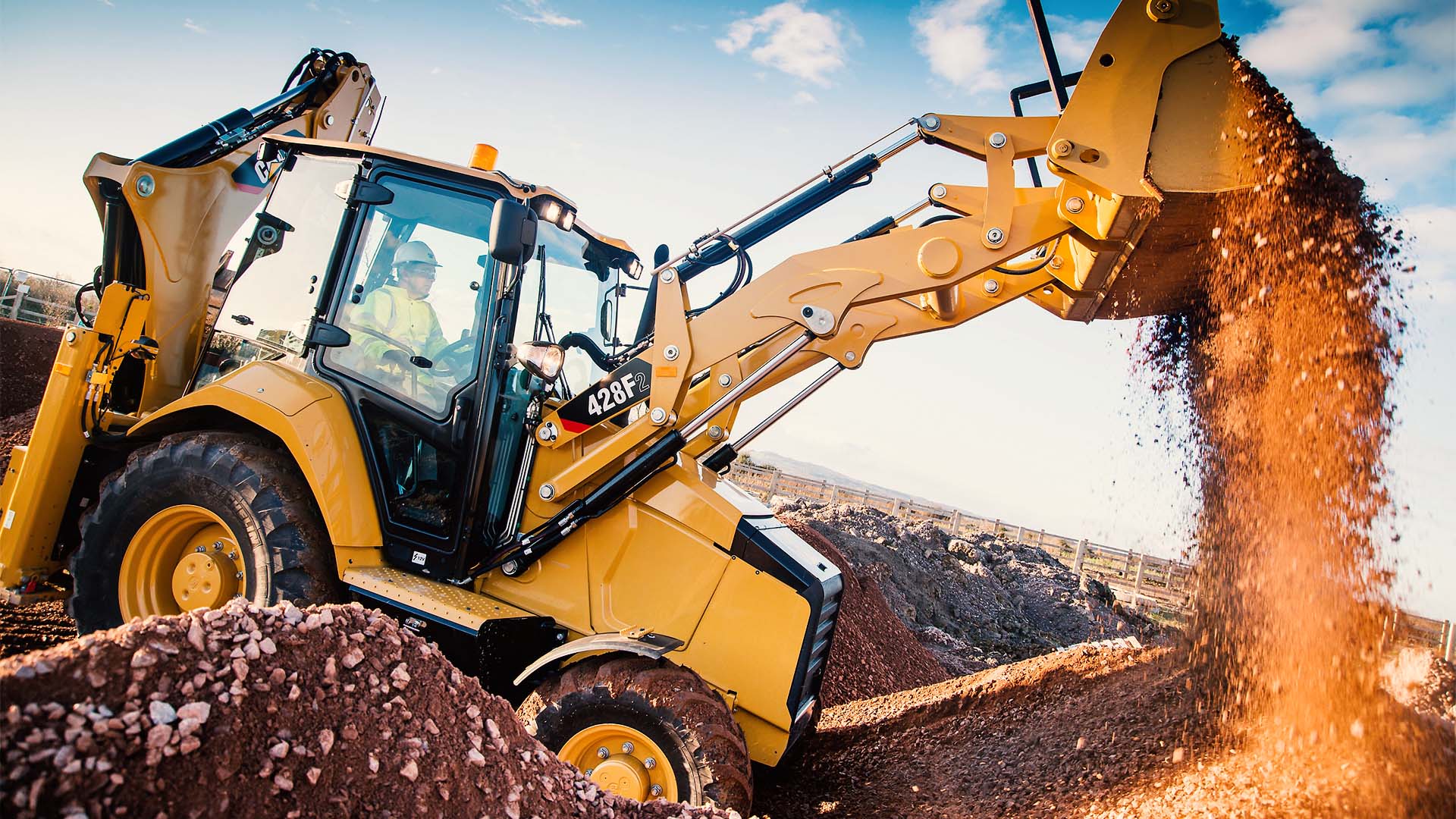 Стрела Cat 428 в работе